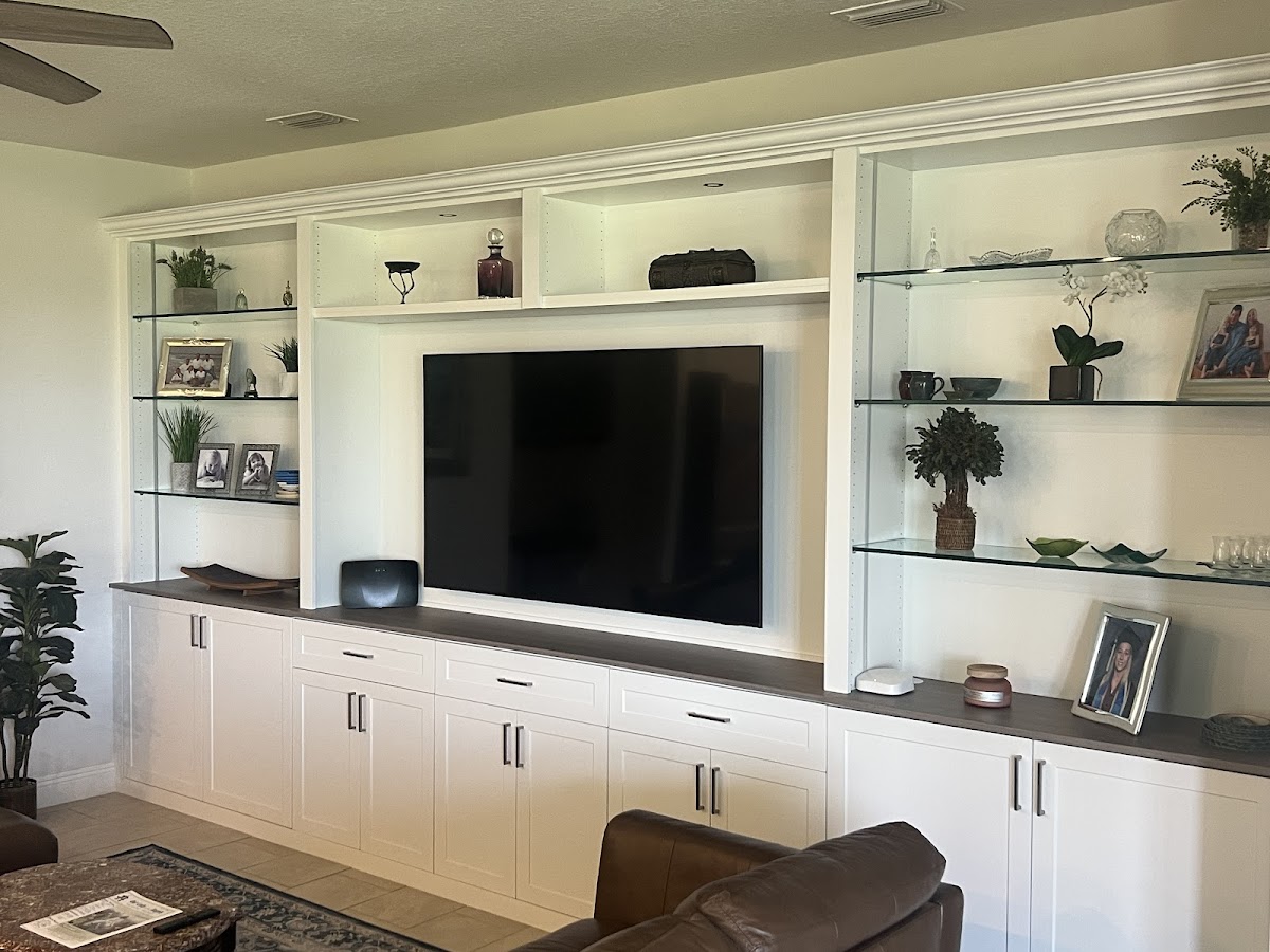 Custom closet organization system with full hanging and drawer zones in Venice FL