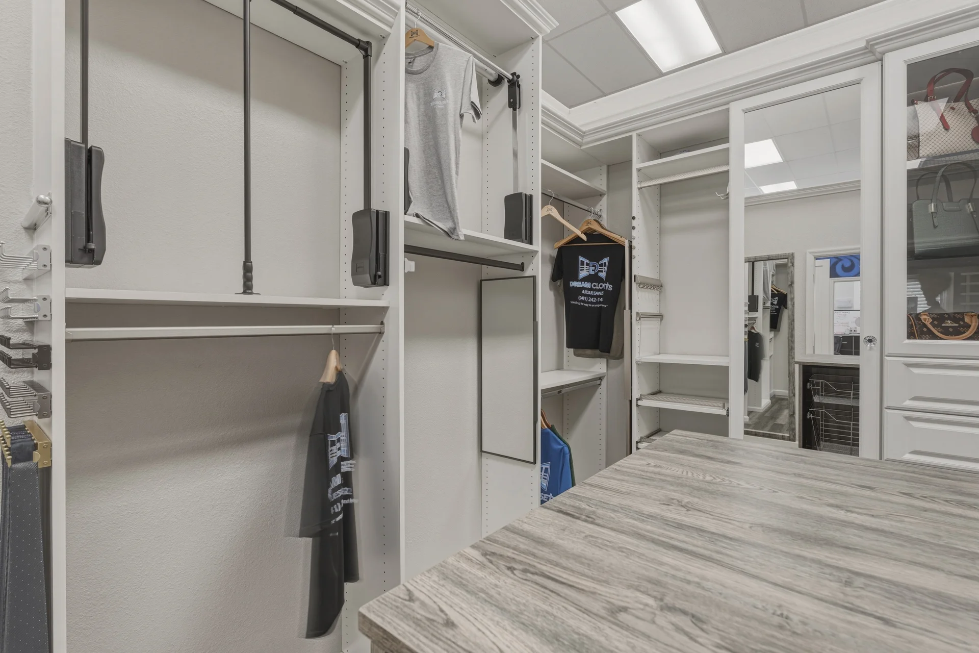 Dream Closets LLC showroom closet display featuring hanging rods, adjustable shelving, and premium finishes in Bradenton FL