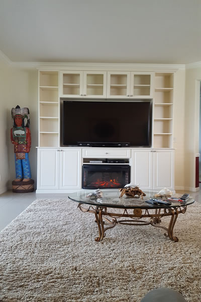 Large custom media center with storage cabinetry in Sarasota FL